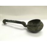 An unusual Oriental bronze long handled vessel, ap
