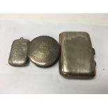 A silver vesta a silver cigarette case and a small