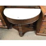 A late Victorian wash stand with a white marble to