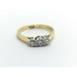 An 18ct gold three stone diamond ring, approx .32c