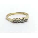 An 18ct gold five stone diamond ring, approx 2.7g