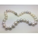 A string of cultured pearls with a 9ct white gold
