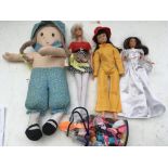 A collection of loose dolls and accessories includ