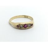 An 18ct gold ruby and diamond five stone ring, app