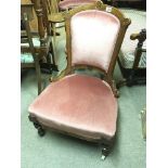 Two late Victorian carved walnut chairs with pink