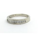 A 9ct white gold half eternity diamond ring set wi