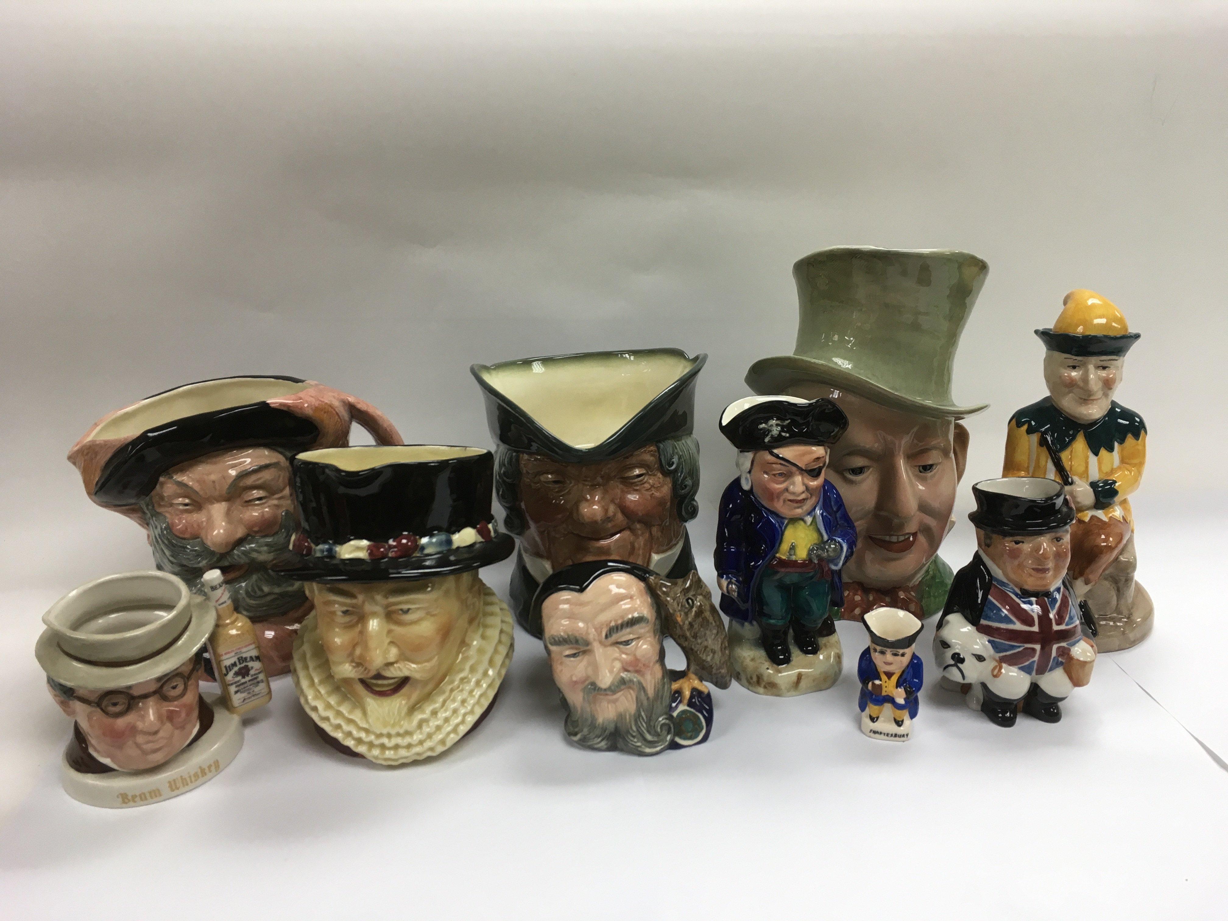 A collection of mainly Doulton character and toby