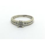 A 9carat gold ring set with a princess pattern of