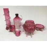 A collection of late Victorian cranberry glass. on