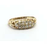 A vintage 18ct gold ten stone diamond ring, approx