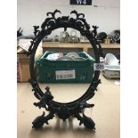 A large oval ornate Victorian spelter mirror frame. H.42cm