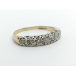 A 9ct gold seven stone half eternity diamond ring,