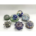 Seven glass paperweights including some millefiori