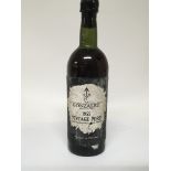 A bottle of vintage Gonzalez 1955 port.( Level low neck)