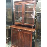 A late Victorian mahogany cabinet with a pair of g