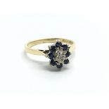 An 18ct gold diamond and sapphire cluster ring, ap