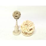 Two early 20th century ivory puzzle balls one with