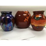 Three contemporary Poole pottery vases .