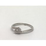 An 18ct white gold two stone diamond ring, approx