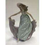 A Lladro figure of a girl in a dancing pose, appro