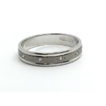 An 18ct white gold half eternity diamond ring, app