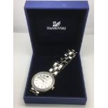 A boxed ladies Swarovski watch with baton numerals