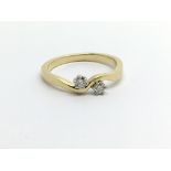 An 18ct gold two stone diamond ring, approx.20ct,