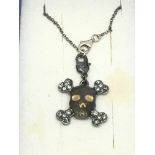 A Vivienne Westwood skull and crossbones pendant o