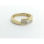 An 18ct gold two stone princess cut diamond ring,