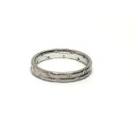 An 18ct white gold eternity ring set with twenty s