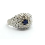 An 18ct white gold sapphire and diamond cluster ri