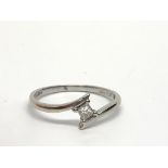 An 18ct white gold solitaire diamond ring set with