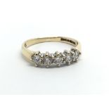A 9ct gold five stone half eternity diamond ring,