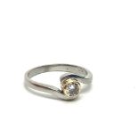 A platinum solitaire diamond ring, approx .12ct, a