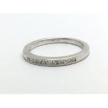 An 18ct white gold half eternity diamond ring, app