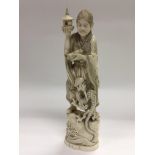 A late 19th Century Japanese ivory carved figure,