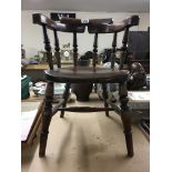 A Victorian child’s oak Captains chair.