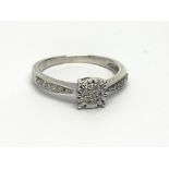 A 9ct white gold diamond cluster ring, approx 2g a