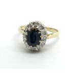 An 18ct gold sapphire and diamond cluster ring, ap