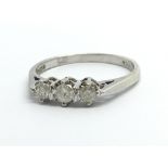 A 9ct white gold three stone diamond ring, approx.