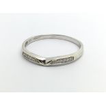 A small 9ct white gold half eternity ring, approx