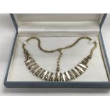 A designer necklace signed Randel and set with mot