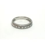 An 18ct white gold seven stone half eternity diamo