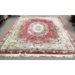 A large Chinese washed wool carpet. 360 x 278cm