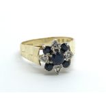 An 18ct gold sapphire and diamond ring in the form