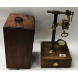 A Victorian cased Brass Botanists microscope by Kimball, London with additional figments and