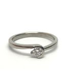 An unmarked white gold solitaire diamond ring, app