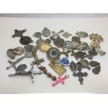 A collection of approx 40 crucifixes and pendants.