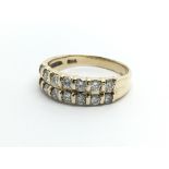 A 9carat gold ring set with two rows of brilliant