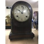 A small mahogany mantle clock by Waterbury clock c